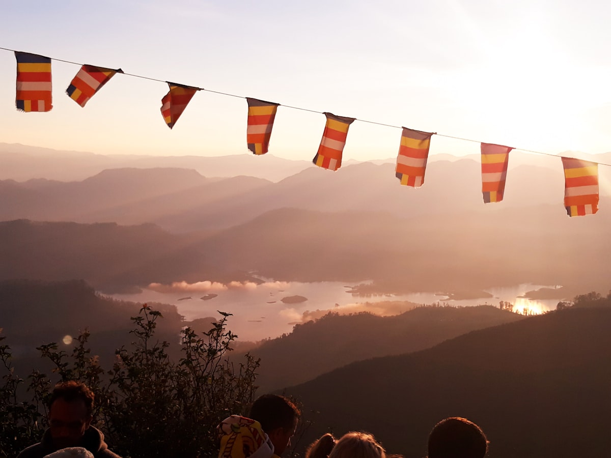 Adam's Peak silhouette at sunrise with the sacred shadow triangle