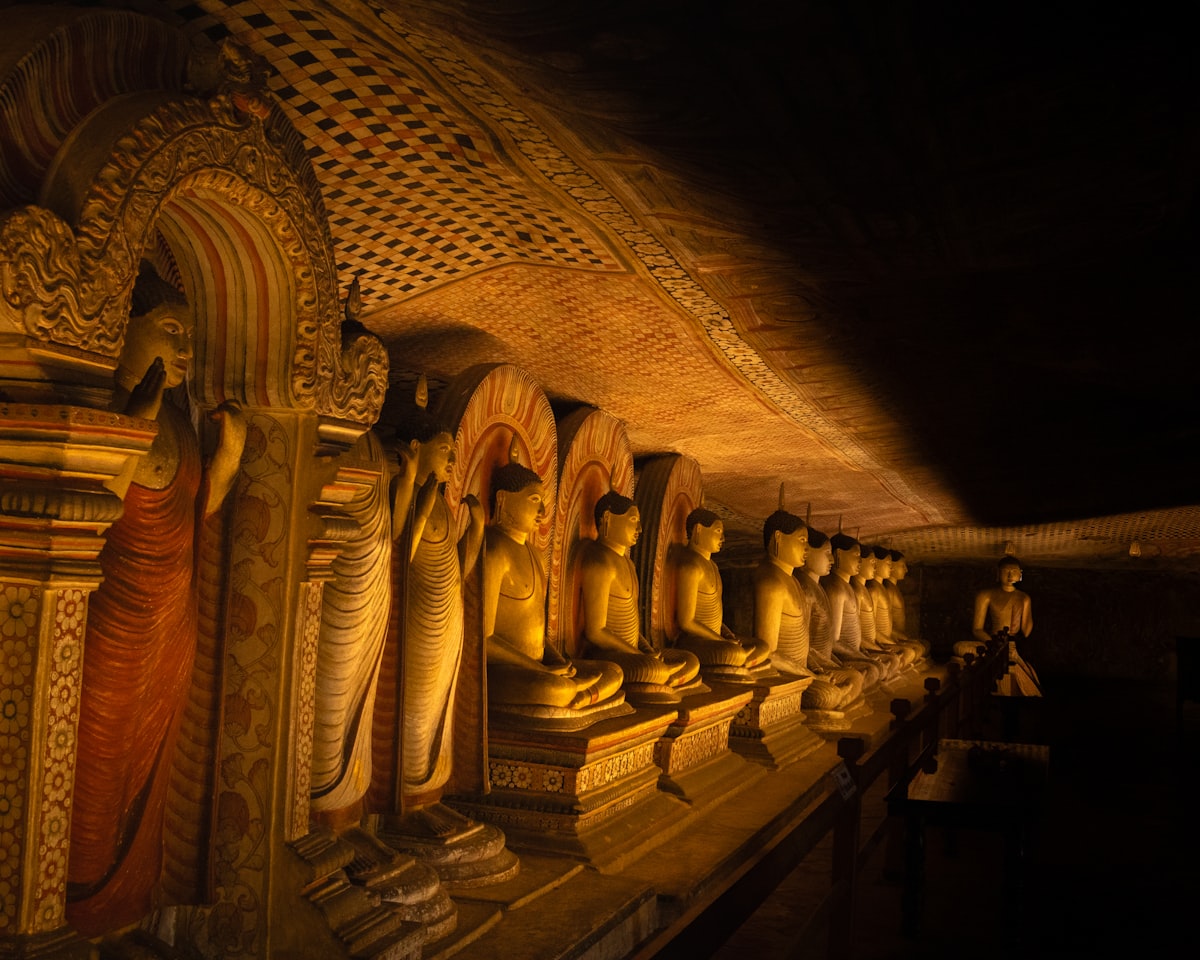 The ornate entrance to the Dambulla Cave Temple complex perched high on a rocky outcrop