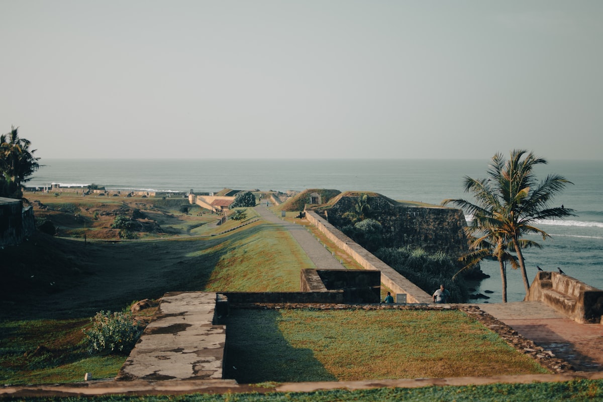 Panoramic view of Galle Fort ramparts stretching along the coast with ocean