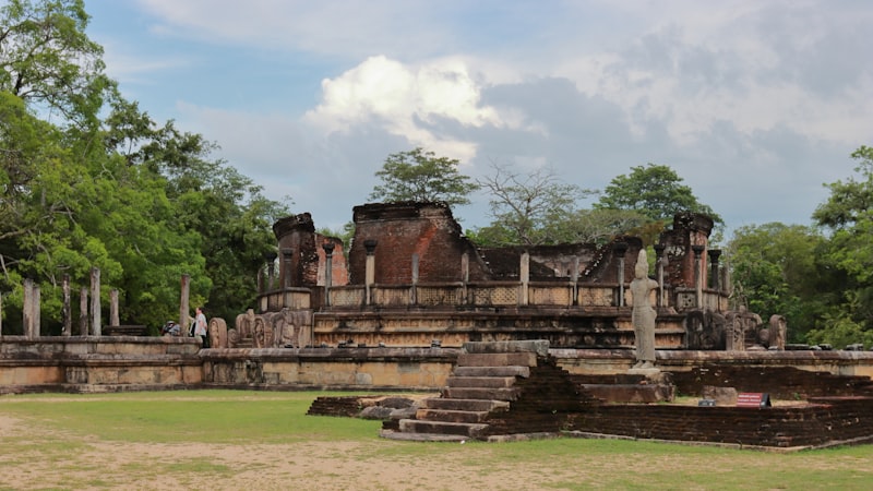 Lankathilaka image house with towering brick walls framing a headless standing Buddha